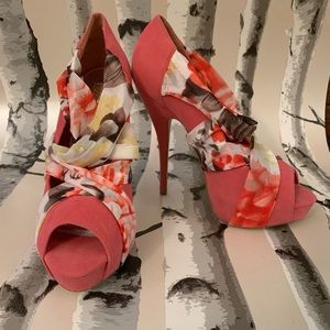 Coral high heels with floral detail on straps